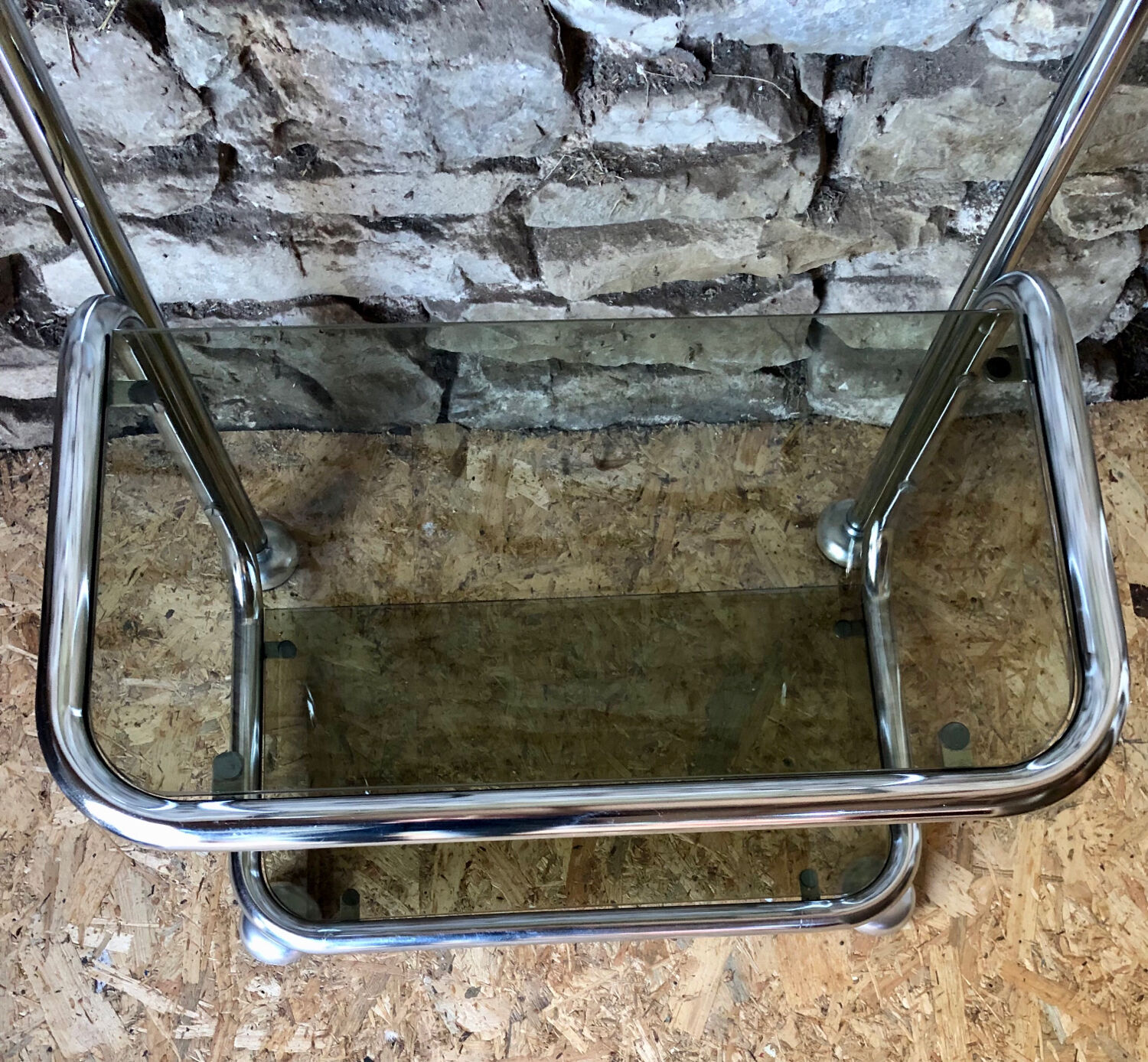 Chromed metal shelf and smoked glass