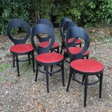 6 vintage Baumann seagull model chairs, black lacquered with red Skai seats.