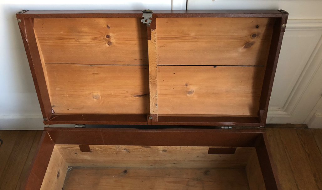 Ancient wooden and faux leather trunk