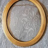 Oval gold frame art deco