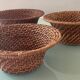 Trio of vintage woven rattan and wicker baskets