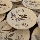 13 decorative plates with hummingbird design in fine earthenware by Mouzin Lecat, 19th century.