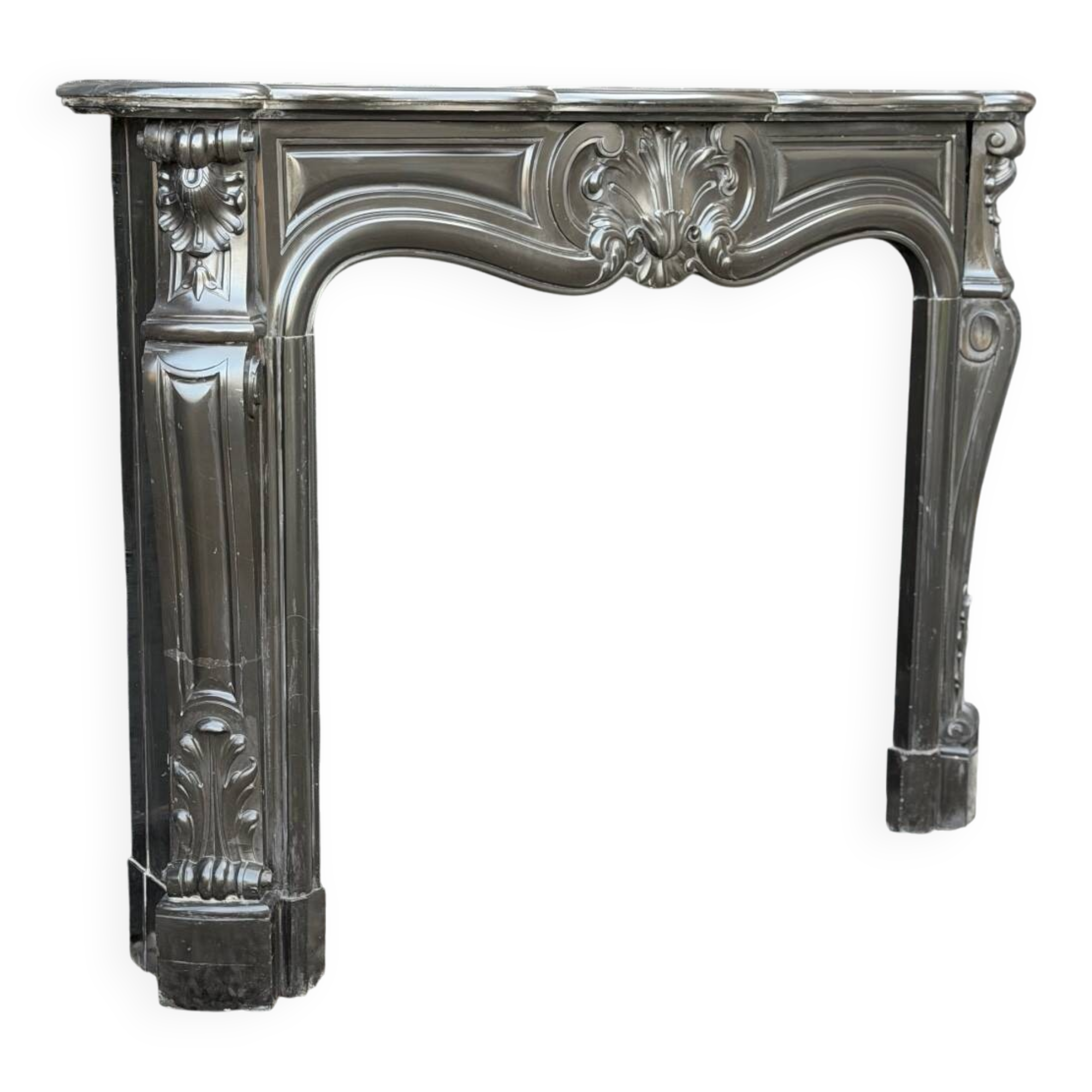 Louis XV style fireplace in black Belgian marble, circa 1880.