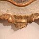 18th-century Italian mirror in gilded and painted wood.