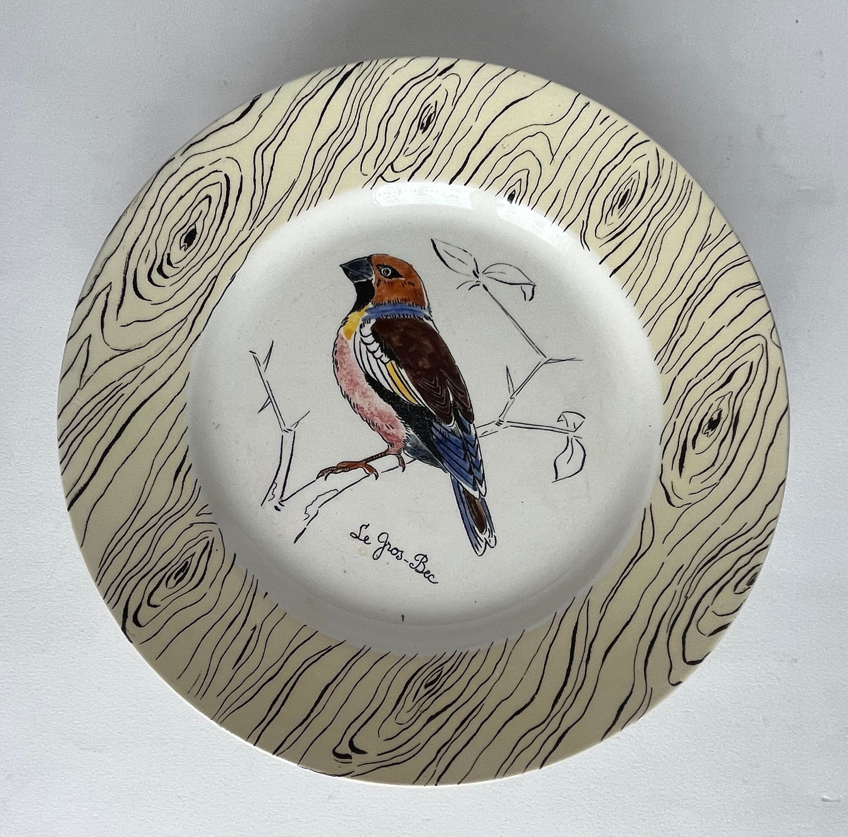 7 antique plates decorated with birds