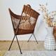 Vintage wicker and metal magazine rack