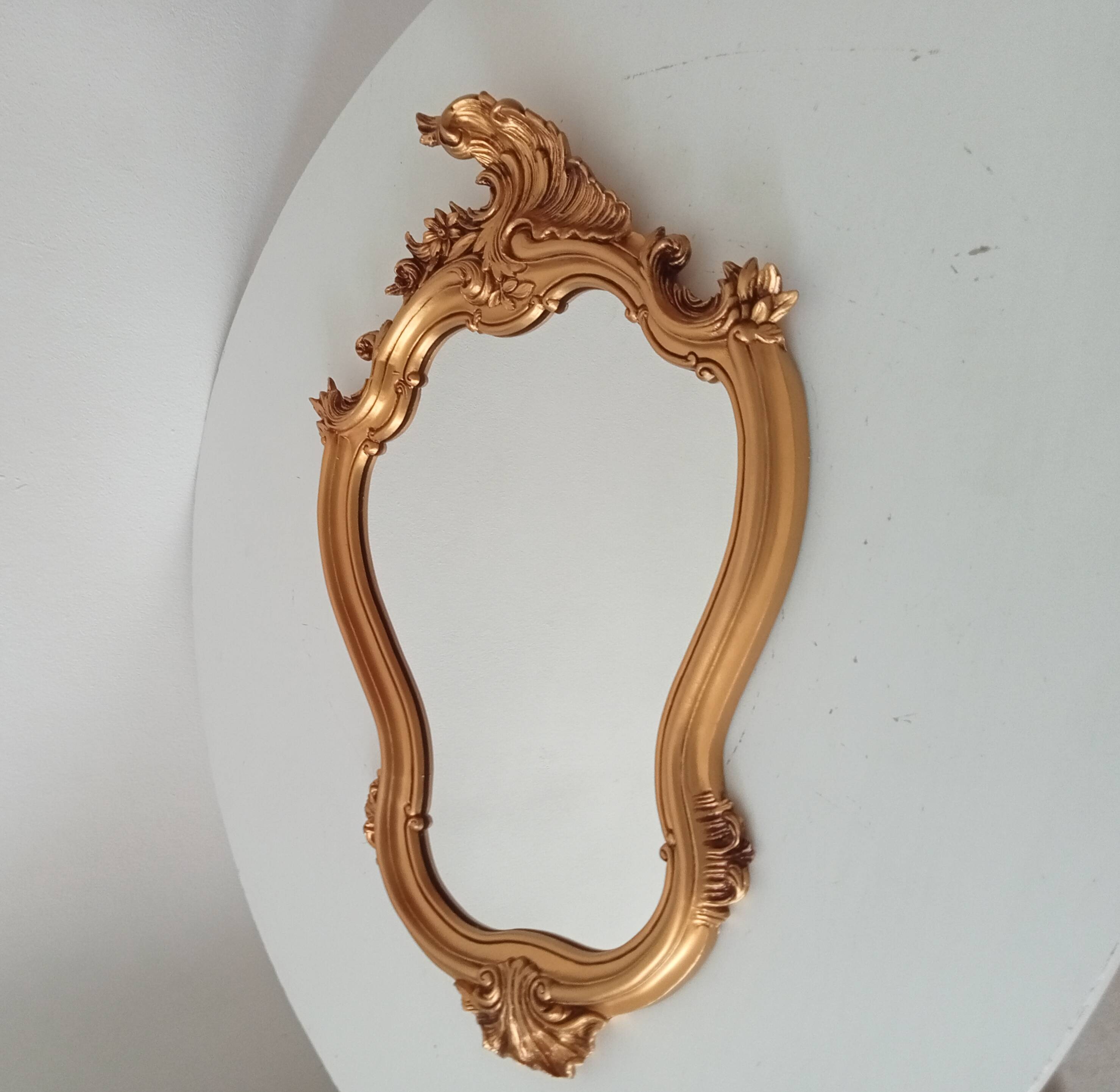 Vintage rococo mirror in gilded resin