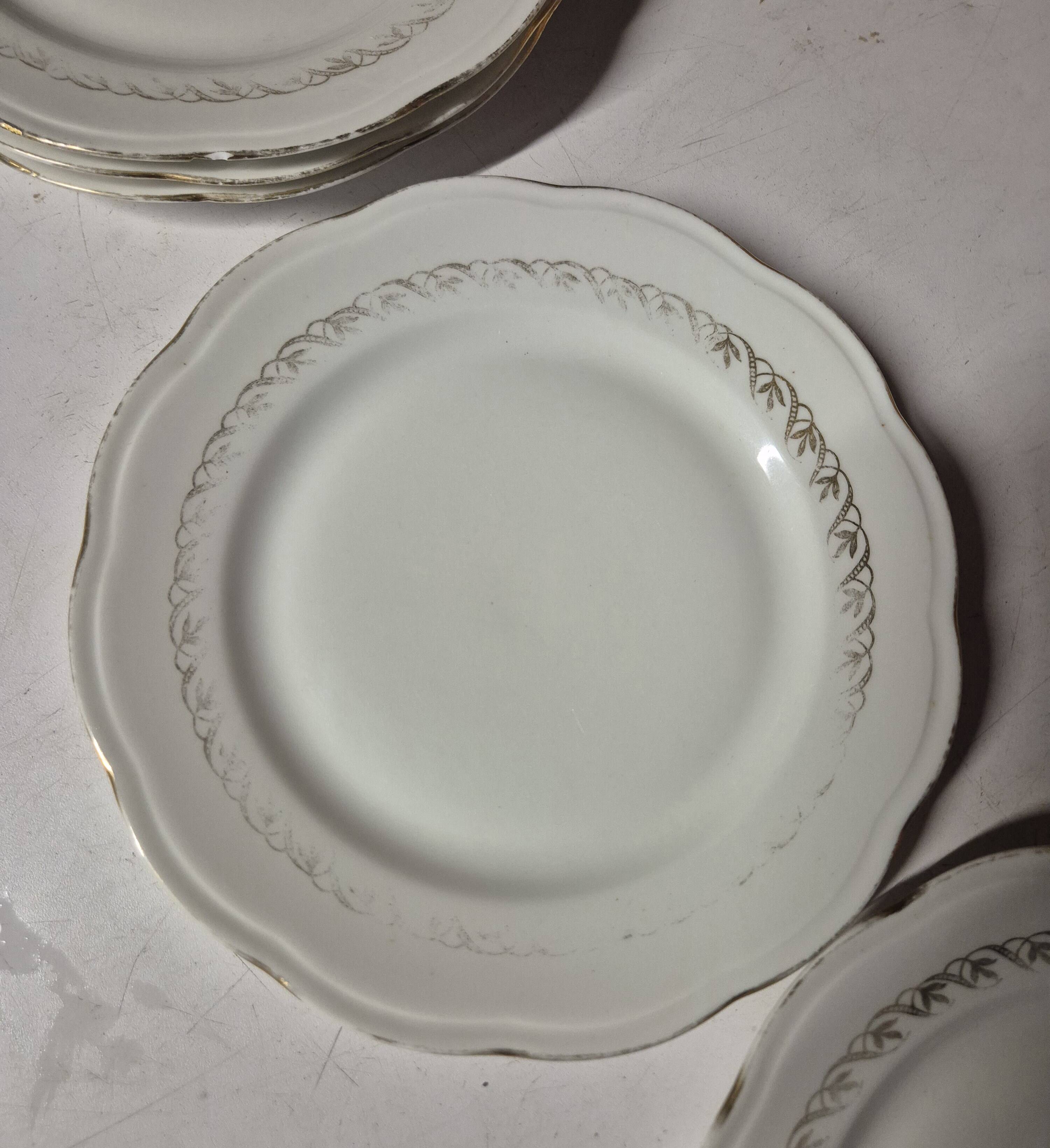 Set of 7 fine porcelain dessert plates with gilding, SFP, French company