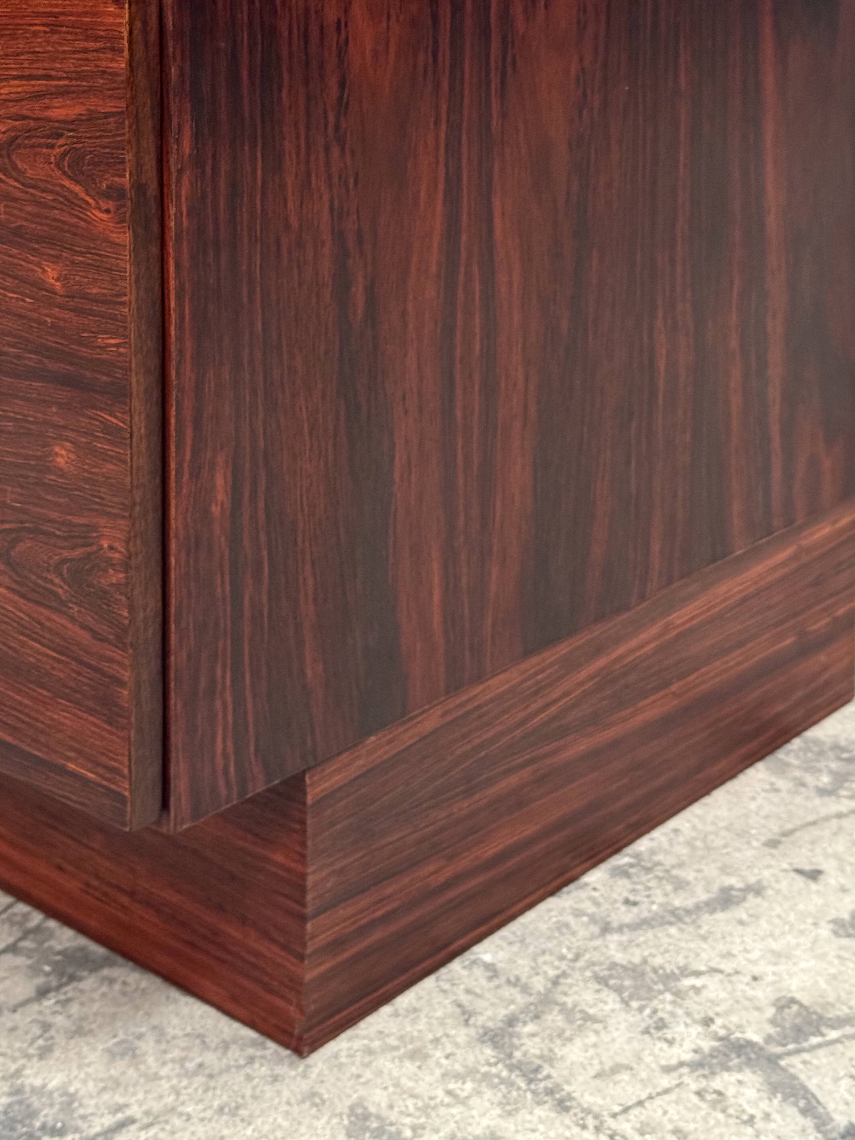 Scandinavian library in rosewood designed by Ib Kofod Larsen.