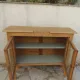 Art Deco sideboard in raw wood with a wax finish, closed by 2 glass doors.