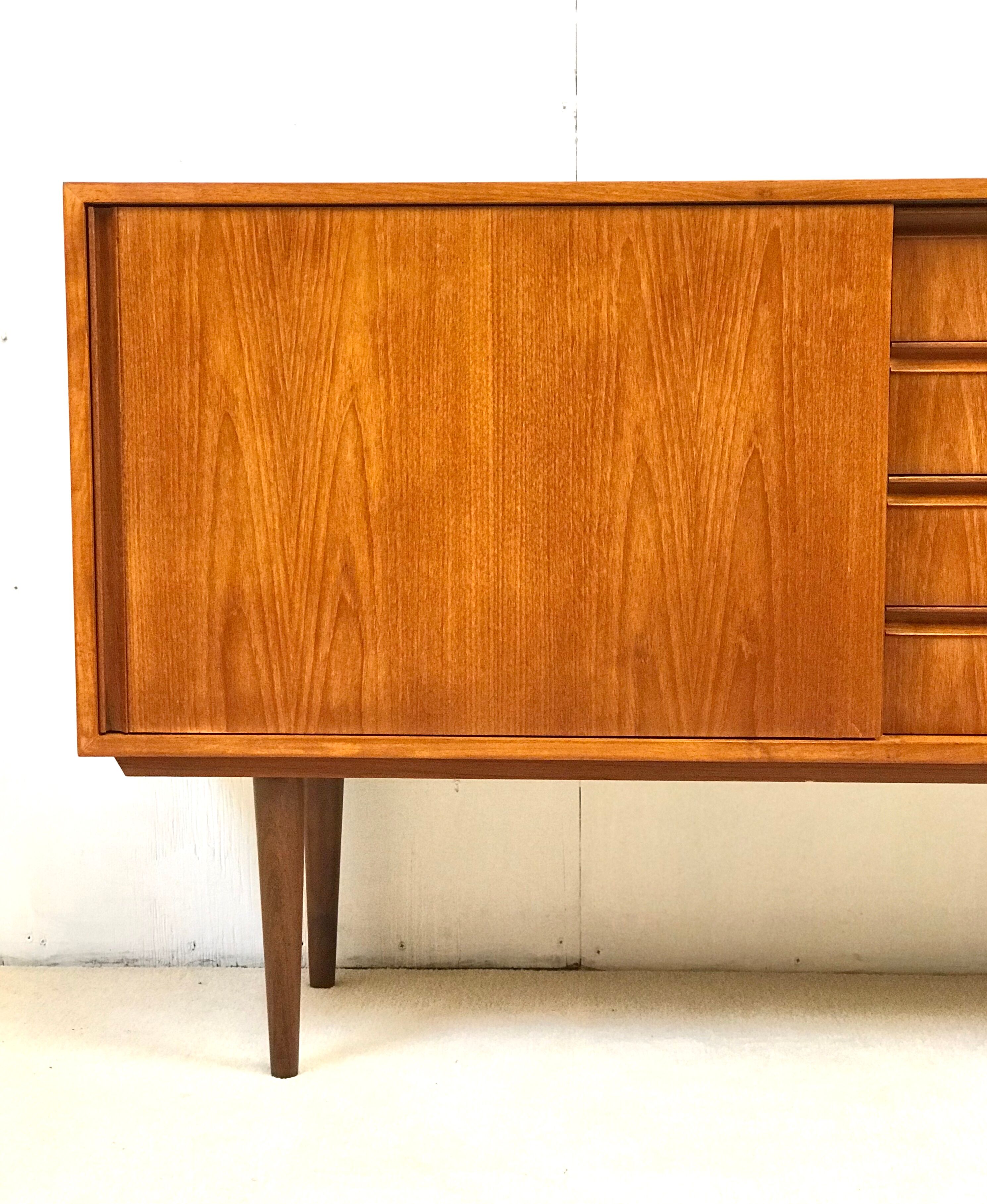 Danish teak sideboard with two sliding doors and 4 central drawers