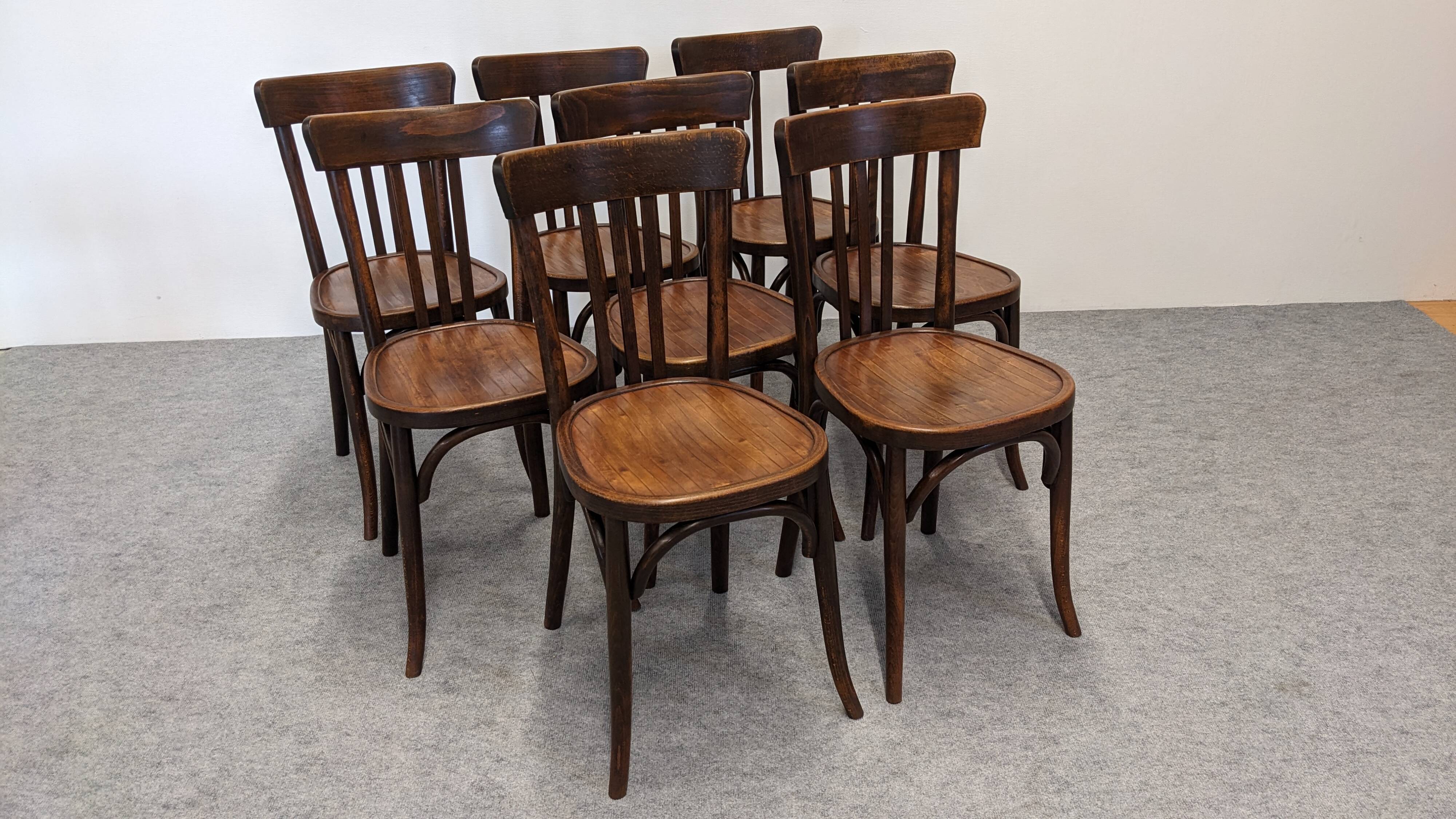 Set of 8 Baumann bistro chairs in bent beech, France circa 1930.