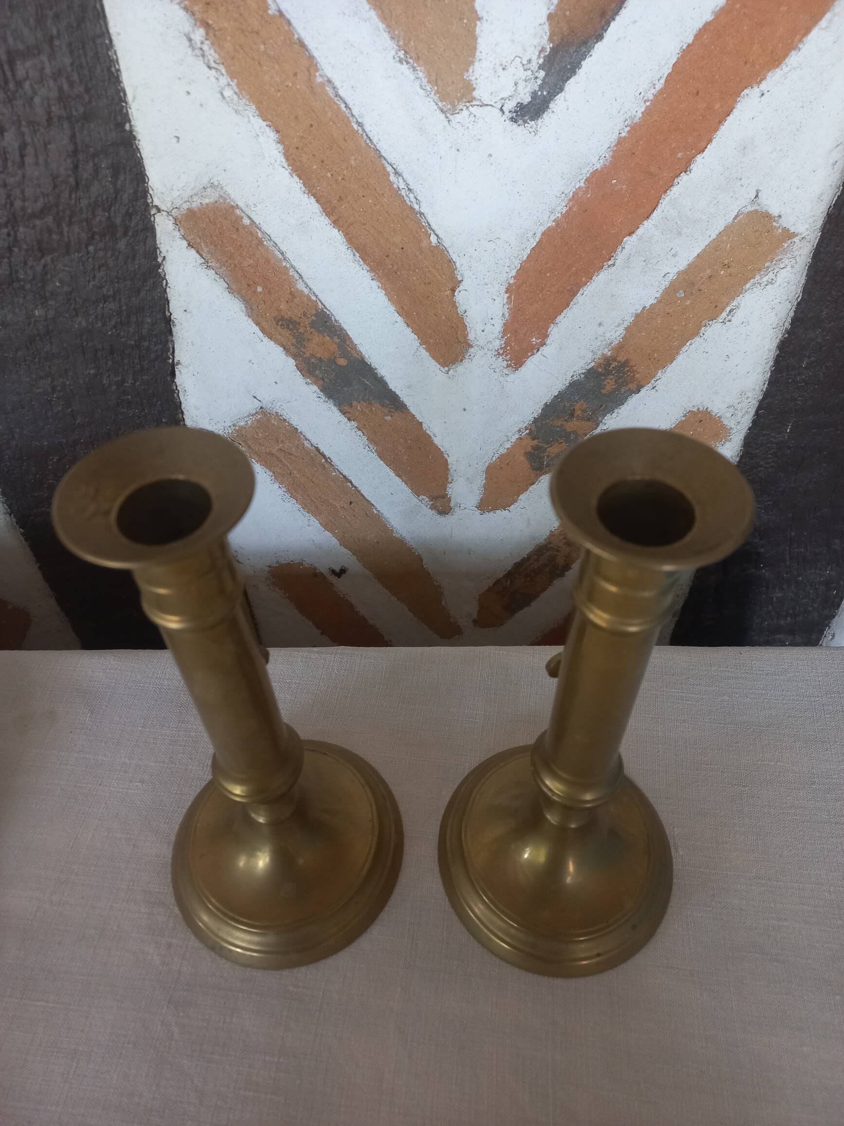 Pair of brass push-button candlesticks