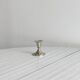 Small shiny metal candle holder
