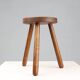 French hand crafted brutalist rustic low tripod stool in solid wood
