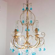 Italian chandelier in gold metal and blue crystal drops
