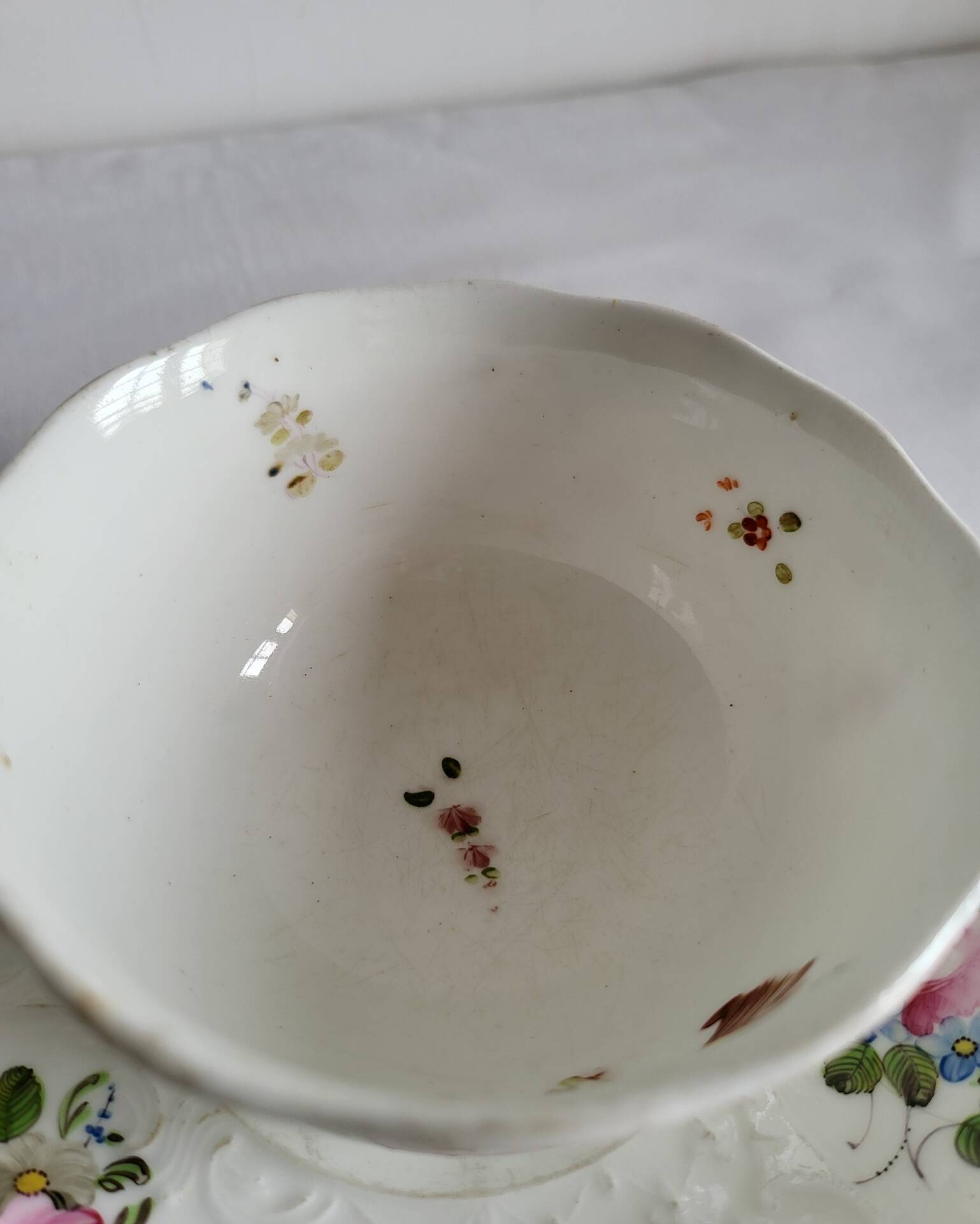 Antique Cup and Saucer in Porcelain with Hand-Painted Floral Decoration