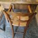 Child's high chair with a rush seat in walnut