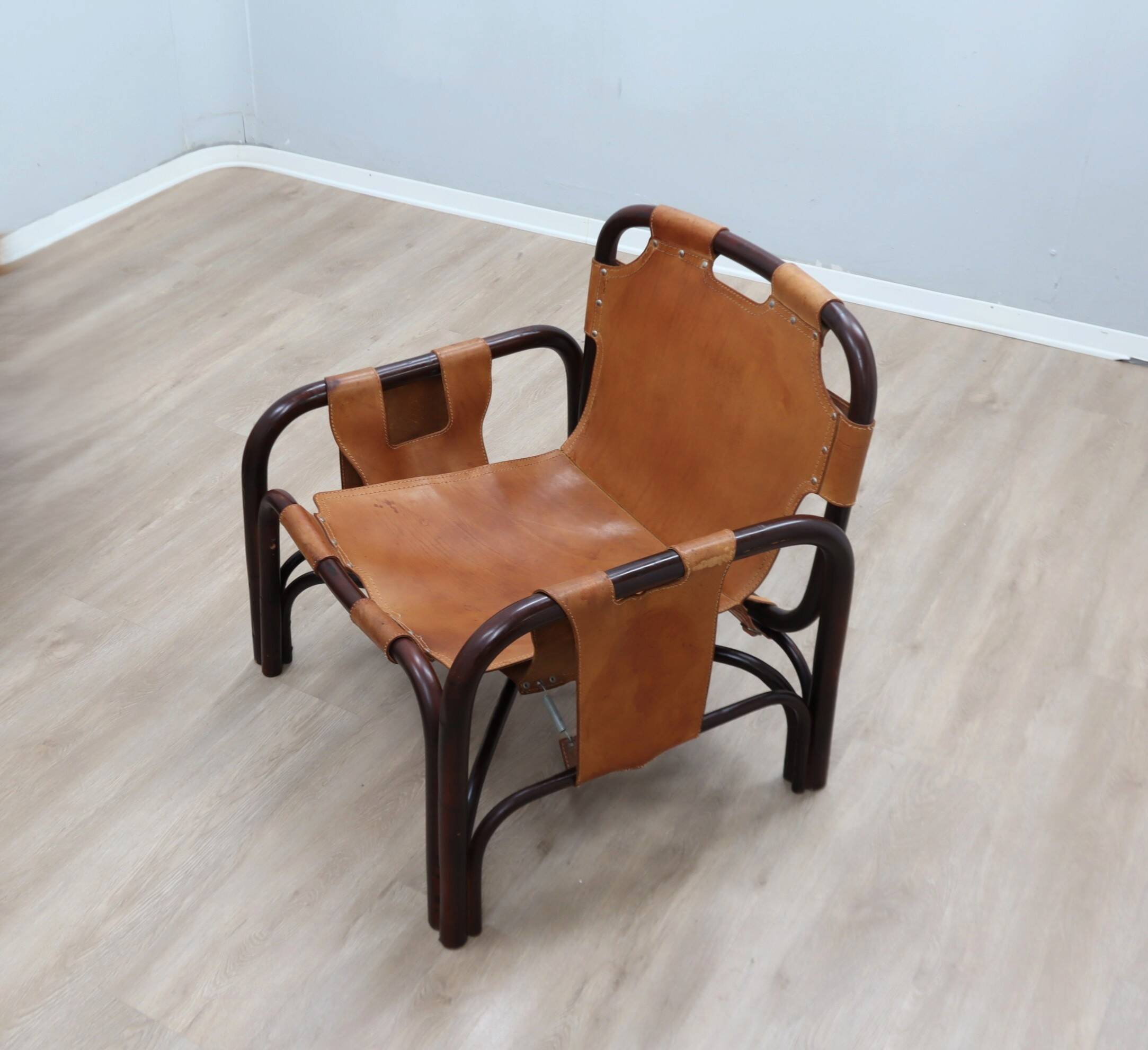 A vintage Tito Agnoli armchair leather and bamboo 1960s