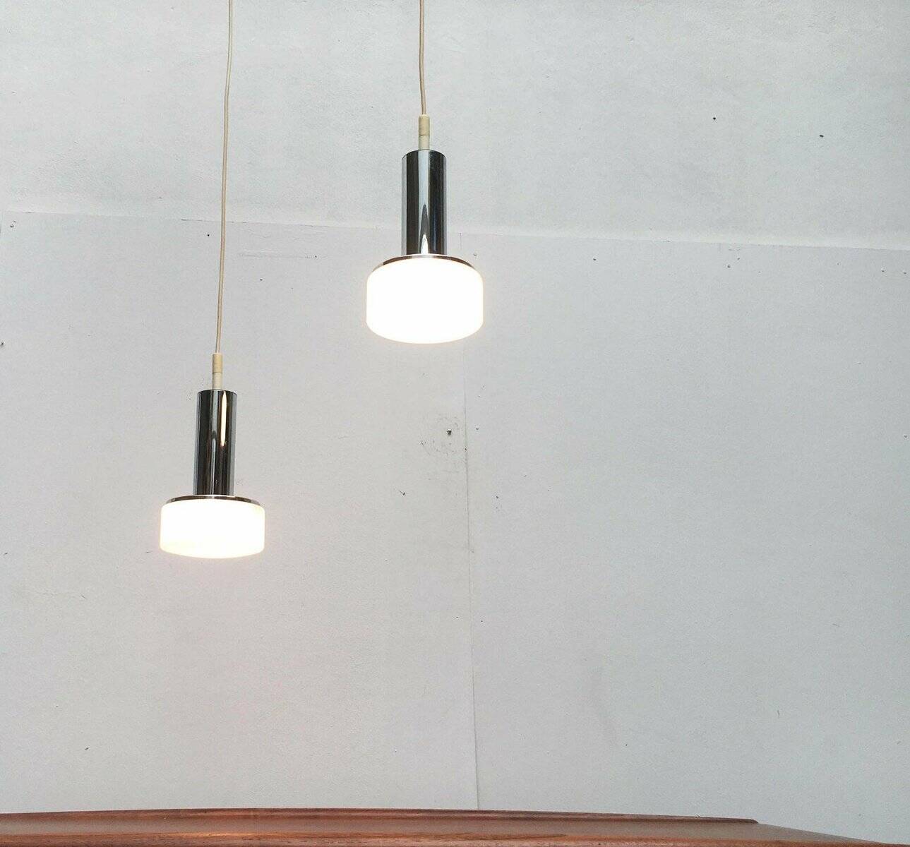 Suspended glass and chrome lamps model P105 German Mid-Century Space Age from the 1960s by Staff, set of 2.