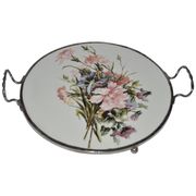 Round white porcelain and metal cake stand, floral decoration, antique style.