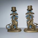 Pair of bronze hand candlesticks decorated with chimeras 19th century