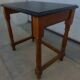 Nightstand or side table in solid wood with a black top.