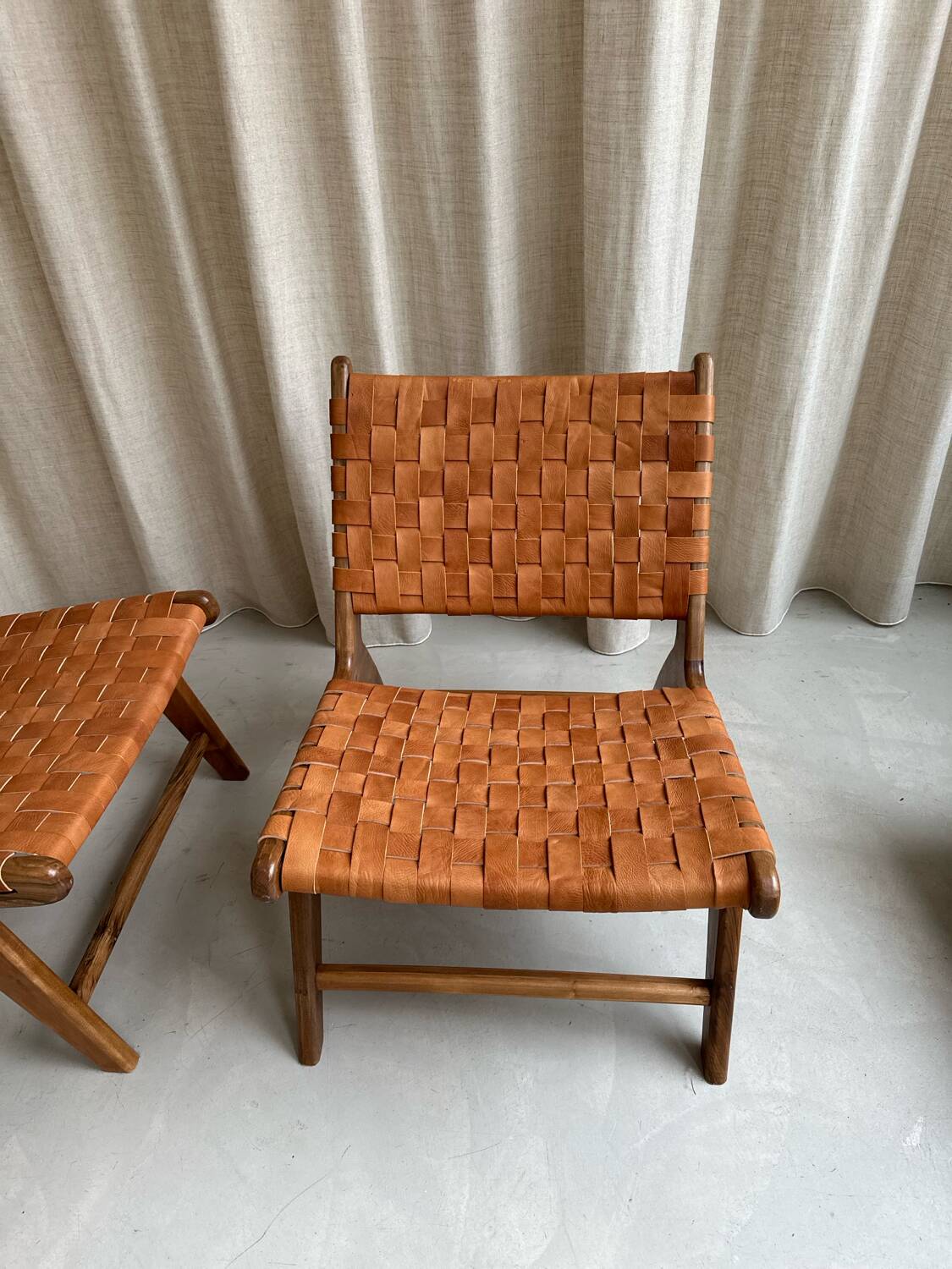 Pair of leather and walnut armchairs