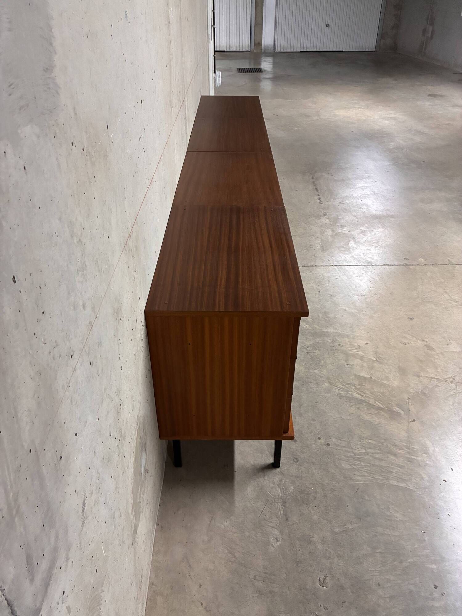 Enfilade buffet display cabinet in vintage 1950s style.