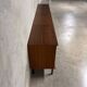 Enfilade buffet display cabinet in vintage 1950s style.