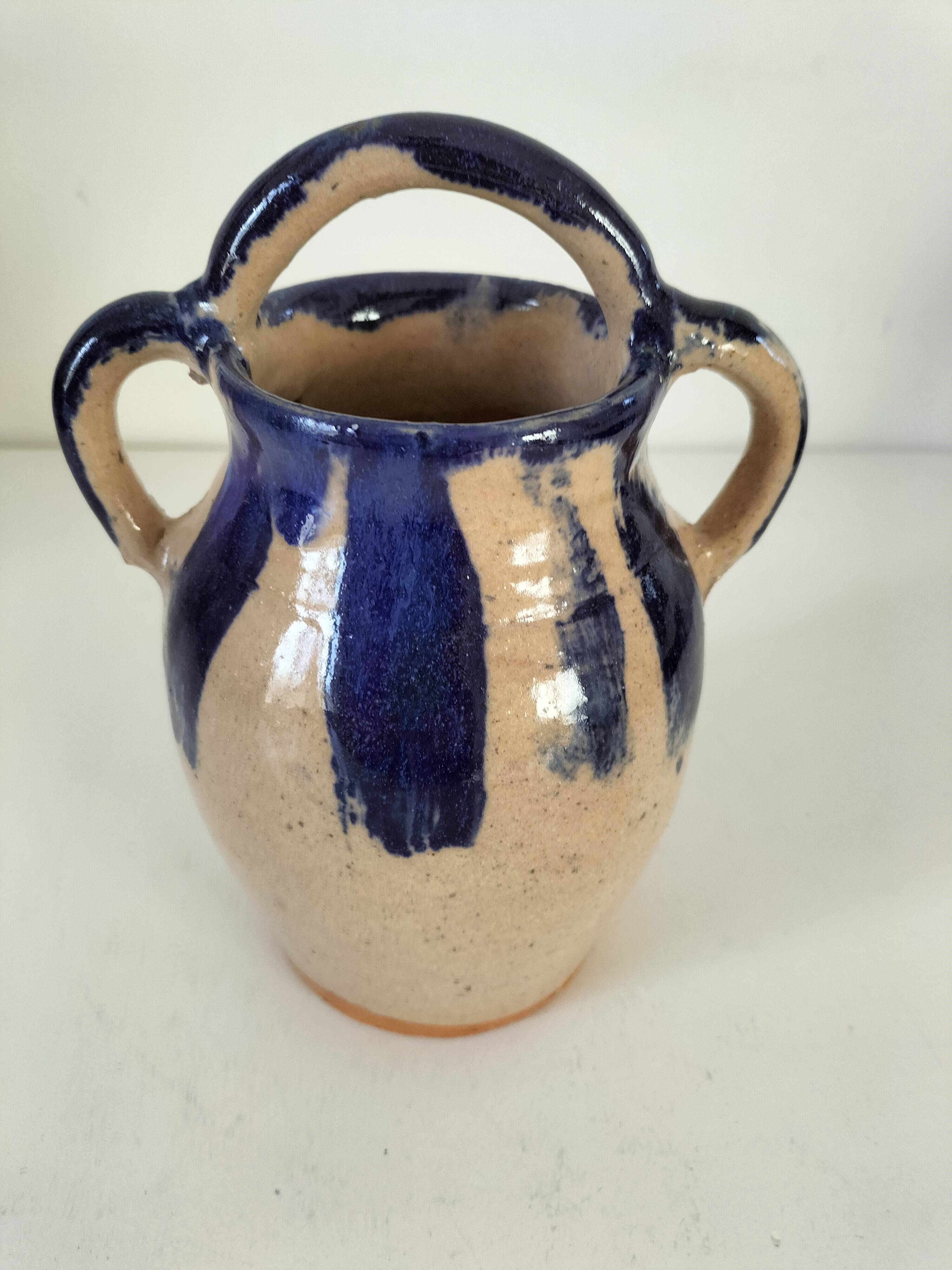 Old pitcher (goat) in cobalt glazed earthenware