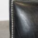 Armchair in black grained cowhide leather with a deep seat