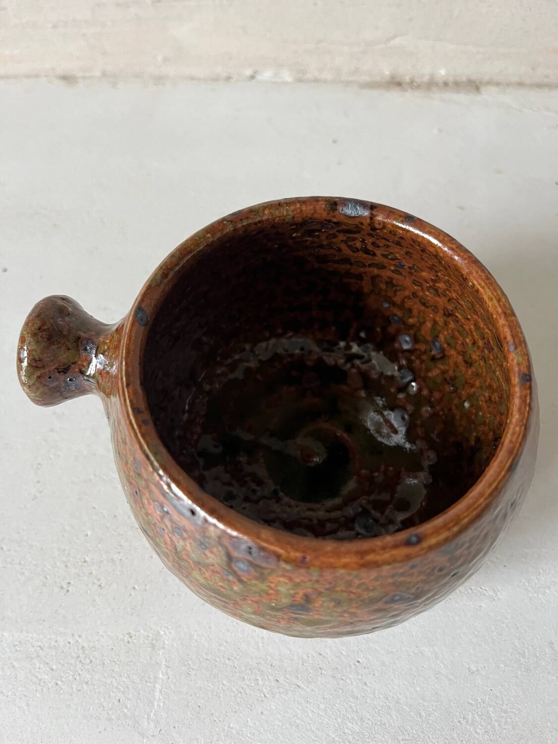 Old pyrite stoneware fondue pot