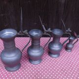 Lot of 4 tin pitchers