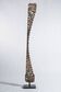 Indonesian construction element in carved wood with intertwined plant motifs mounted on a base (fri