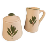 White ceramic pot and mini pitcher with bay leaf illustration