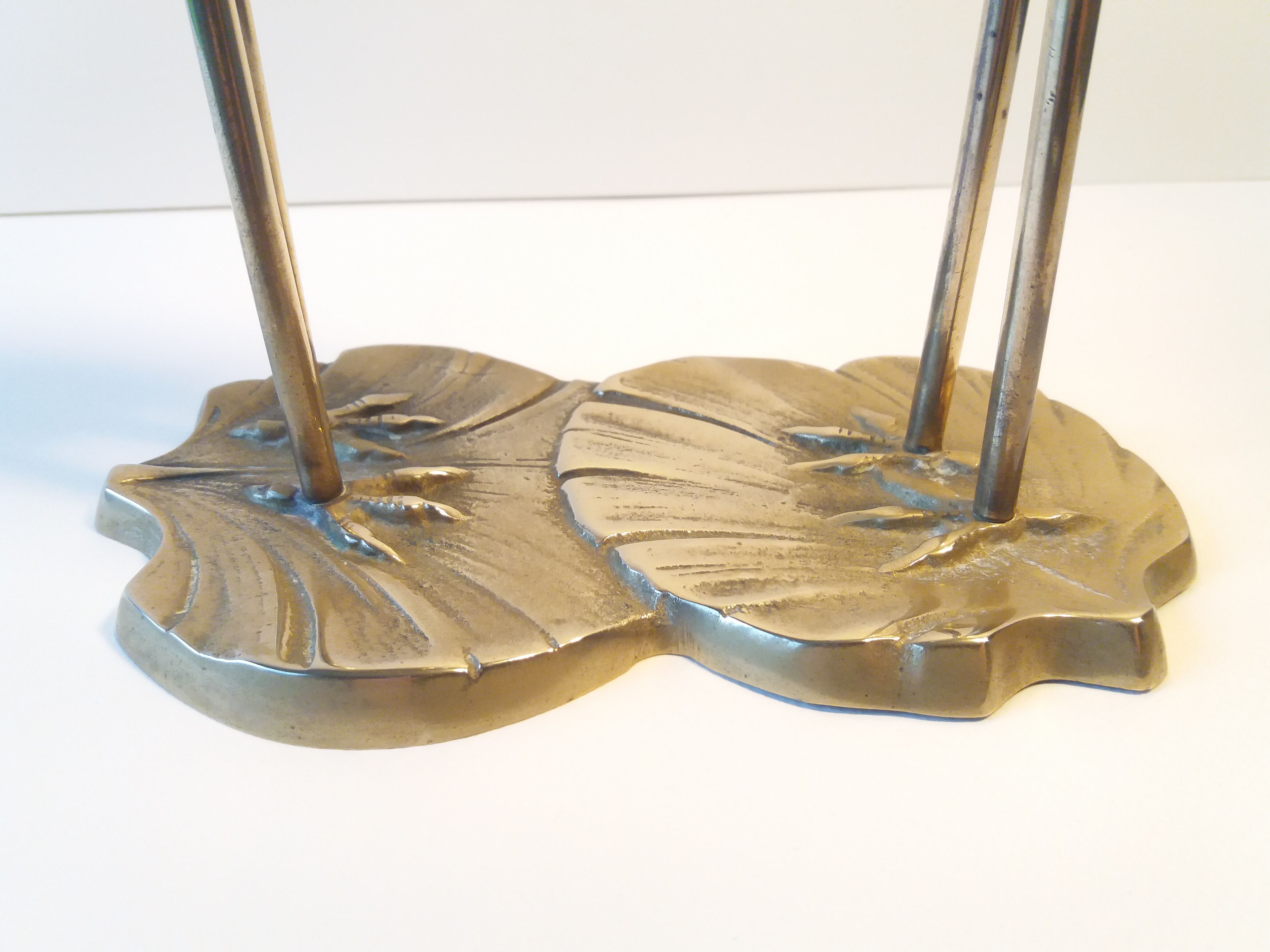 Herons entwined brass