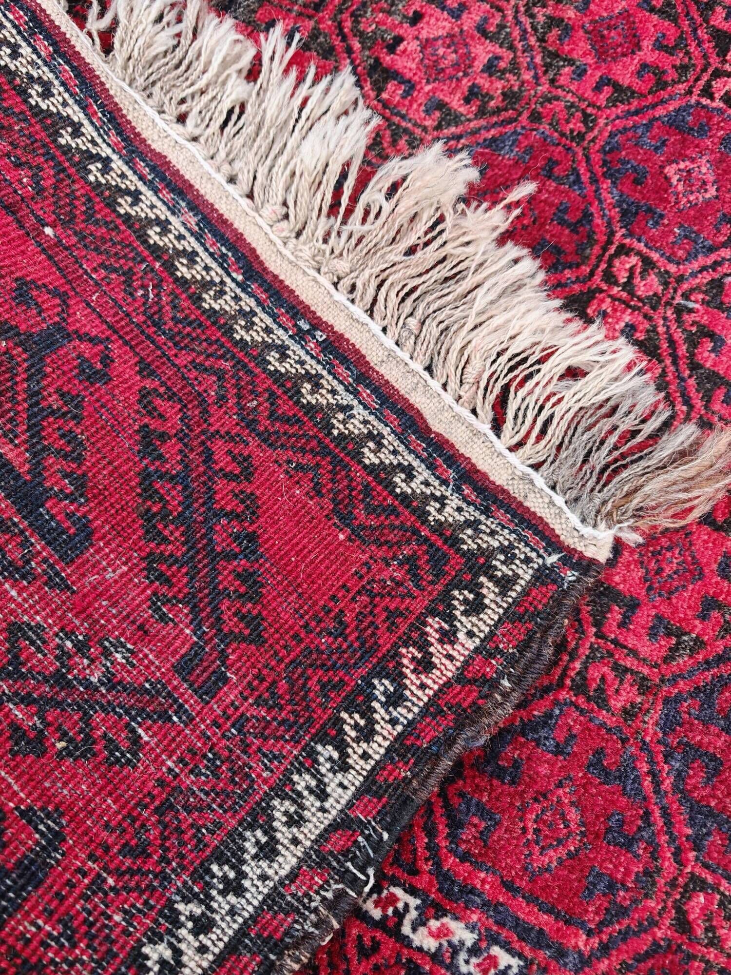 Vintage handmade Baluch rug with geometric pattern from the 1950s.