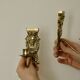 Pair of mid-century Swedish brass face motif sconces