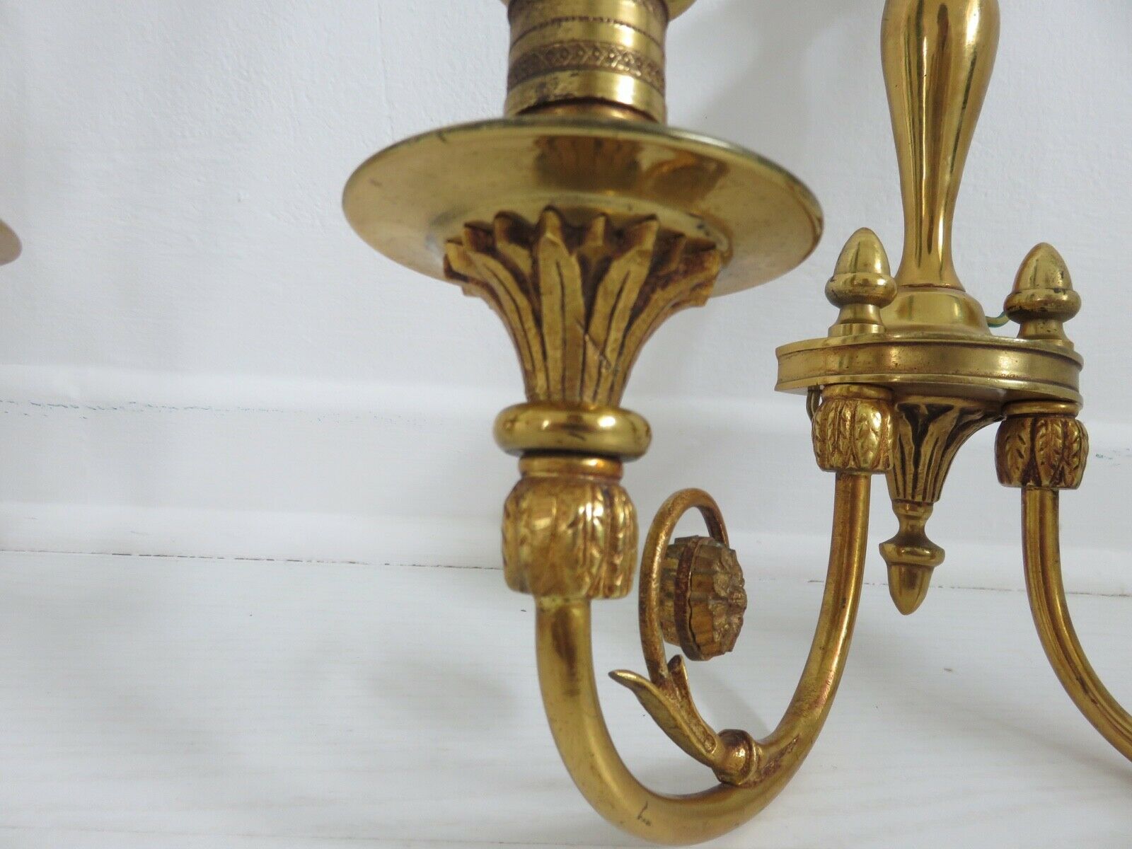 Pair of double wall lamps directoire style Lucien Gau in solid bronze gilded with bright gold
