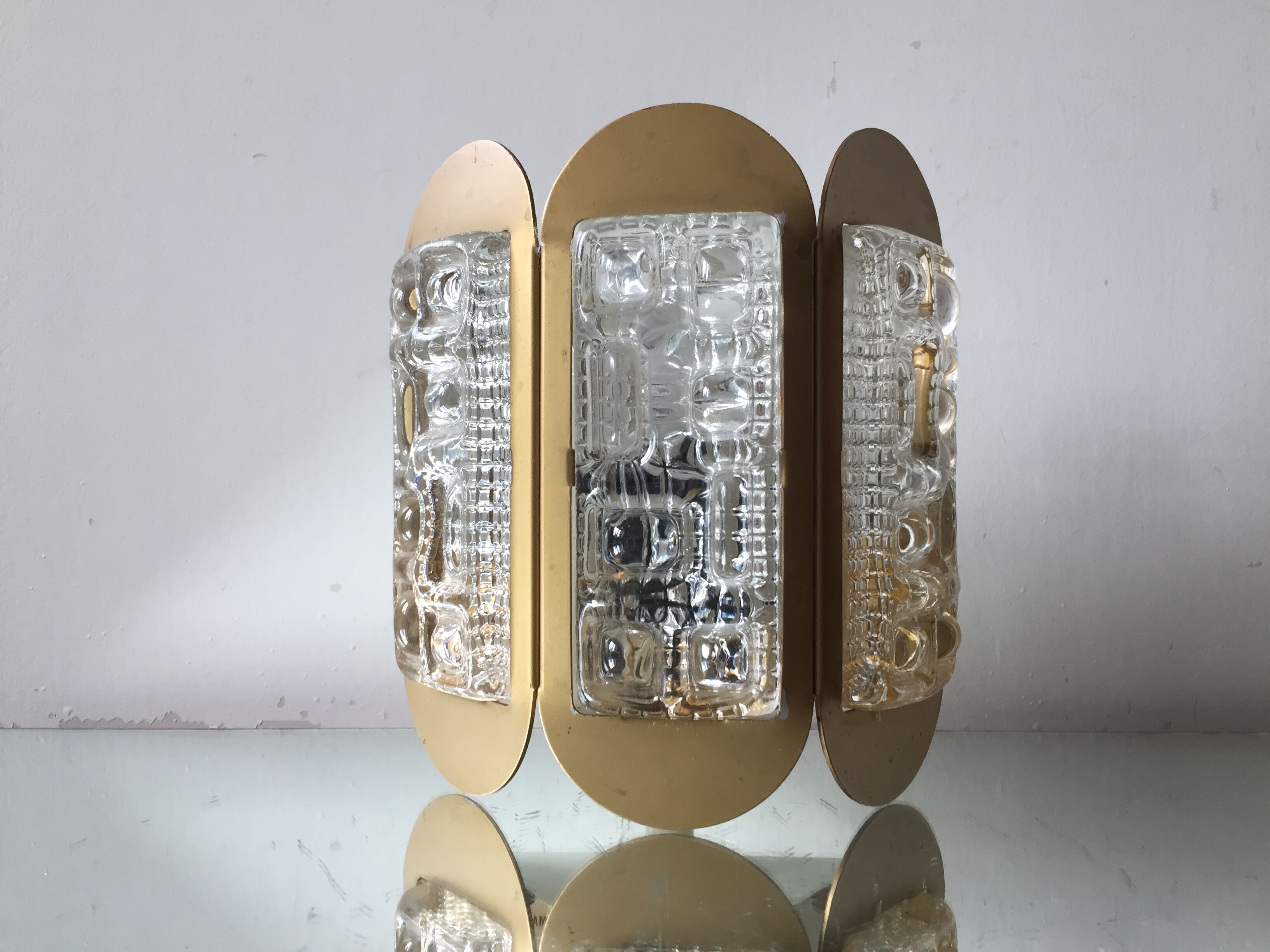 Scandinavian midcentury wall light in crystal and mat gold colored metal