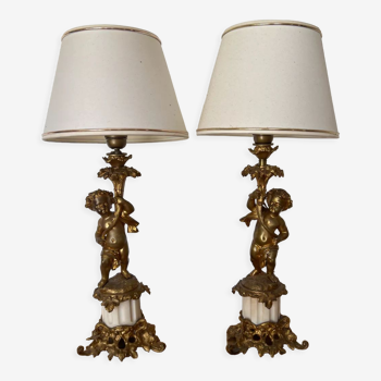 Pair of bronze lamps with puttis