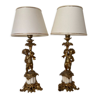 Pair of bronze lamps with puttis