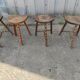 Lot 4 twisted wood tripod stools