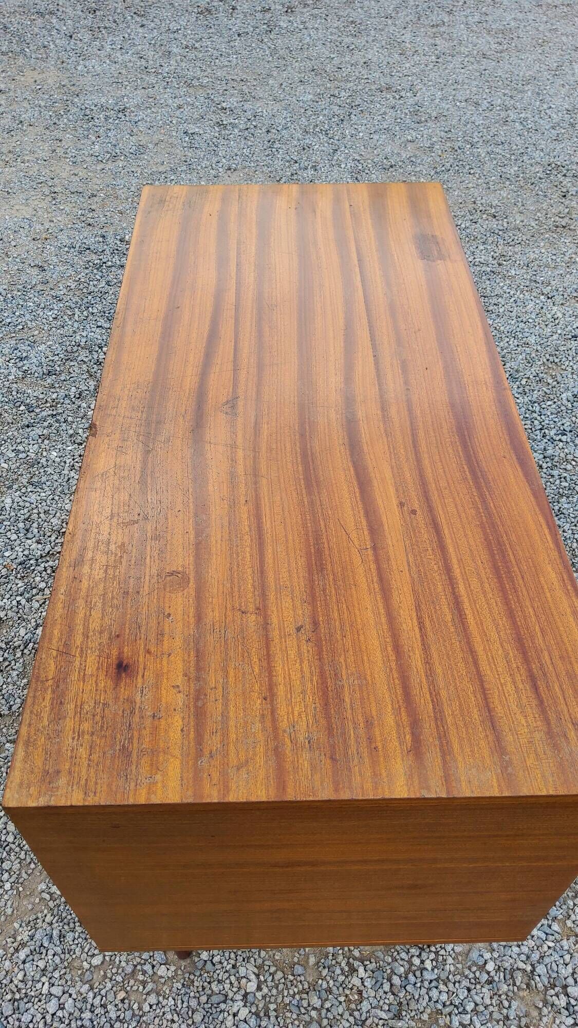 60s desk in golden blond mahogany with conical coffered feet