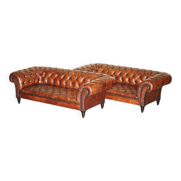Pair of Early Victorian leather Chesterfield sofas by George Smith.