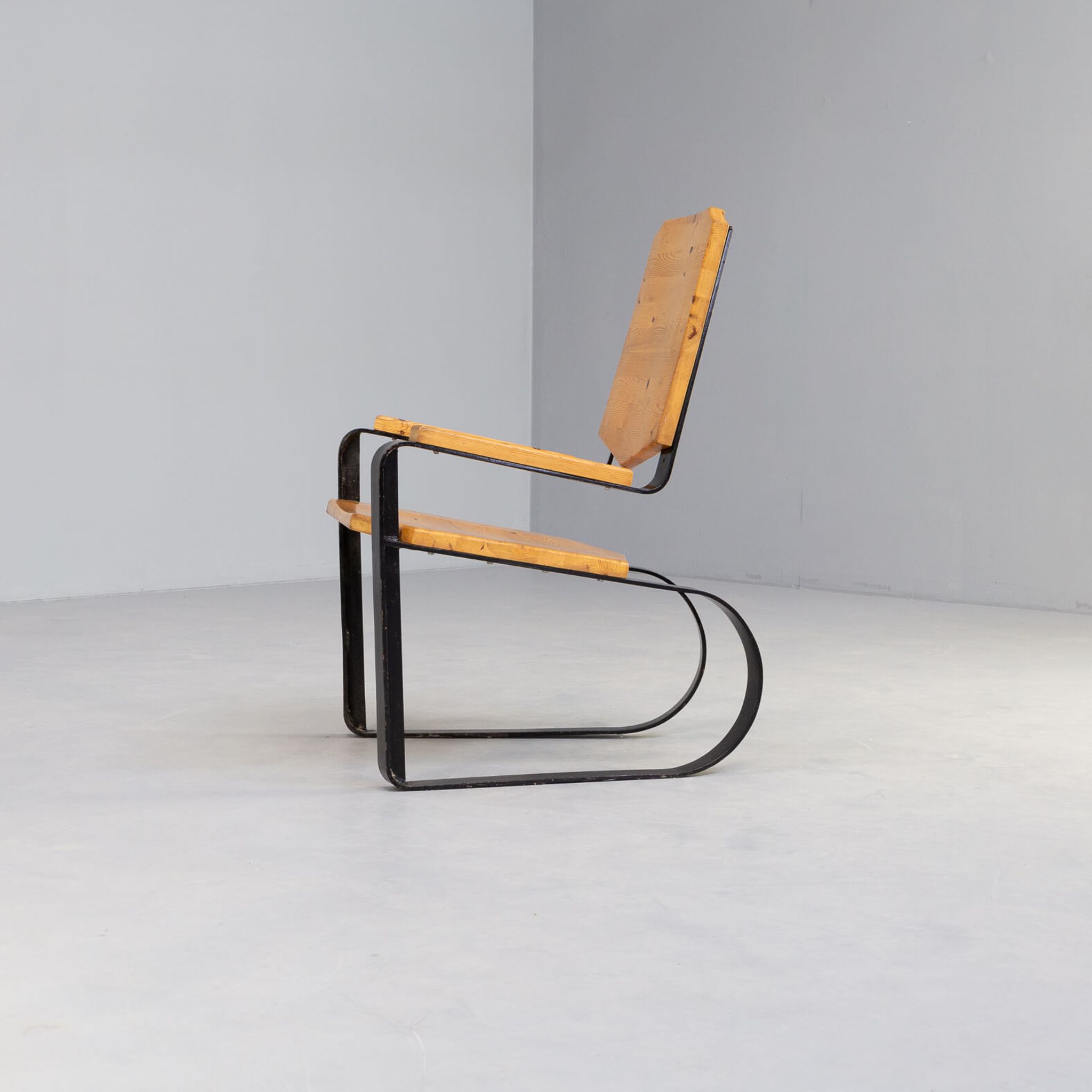 60s Unique metal cantilever framed lounge chair with pine seat