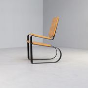 60s Unique metal cantilever framed lounge chair with pine seat