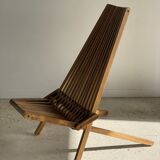 Foldable designer armchair in wooden slats