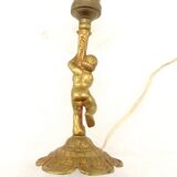 Lampe à poser cherubin en laiton.